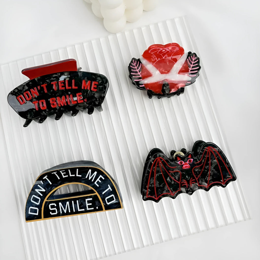 Halloween hair clip with detailed acetic acid shark and bat design in one of four colour variations.