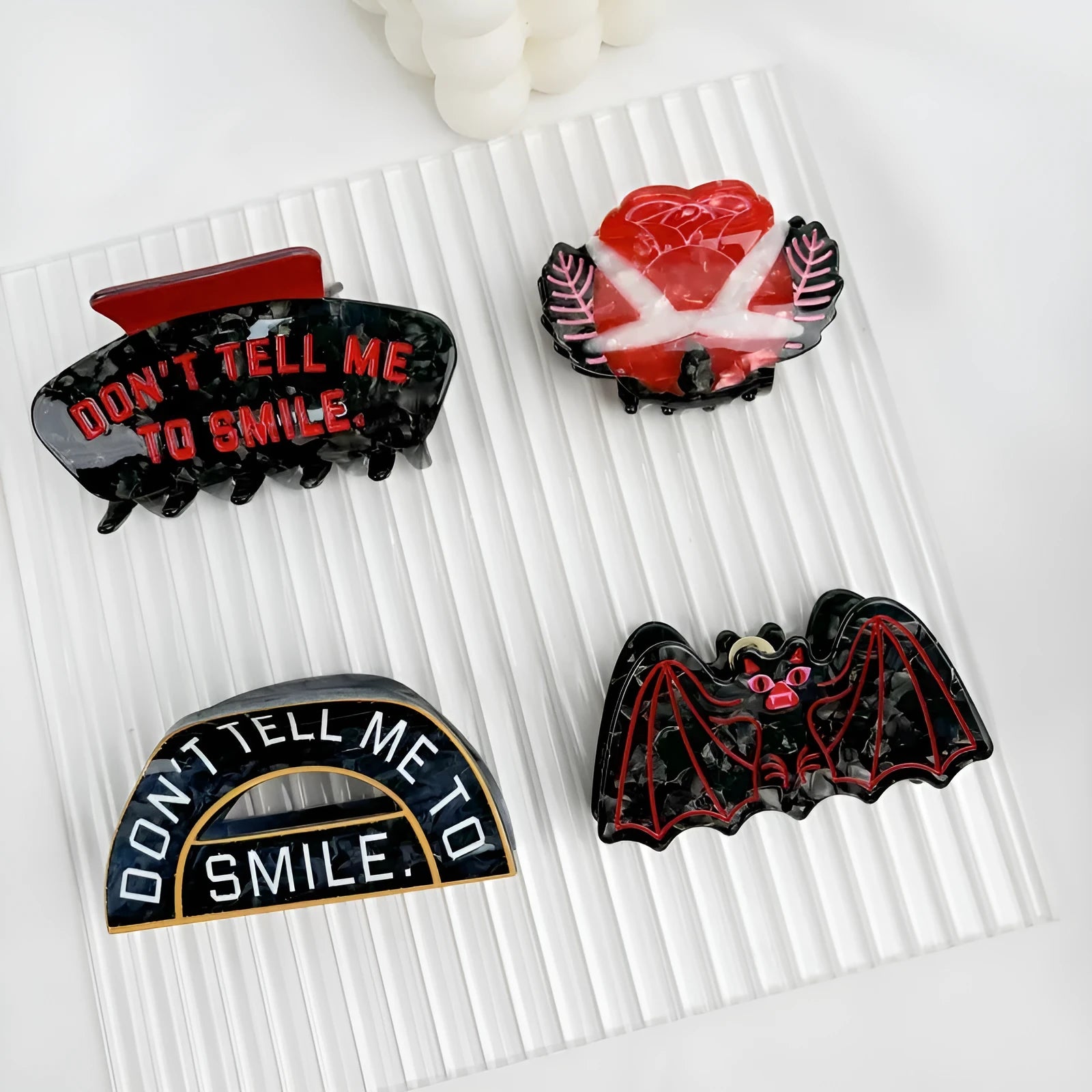 Halloween hair clip with detailed acetic acid shark and bat design in one of four colour variations.