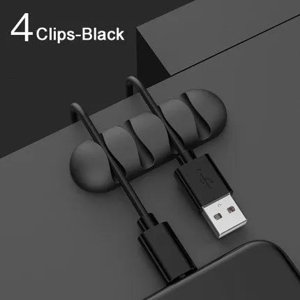 Smart cable holder with TPR flexible clips in black holding USB earphone and network cables on a desk