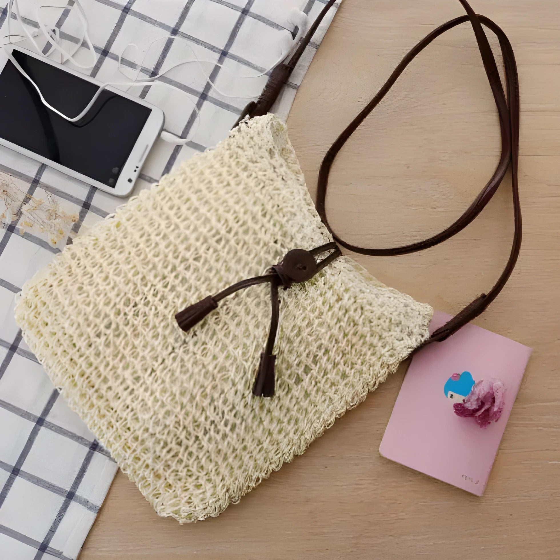 Handmade crochet crossbody straw bag for children in khaki with cotton lining and woven texture