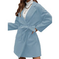 Long sleeve loose fit lapel coat with button front, split hem, and self-tie belt in thick polyester fabric.