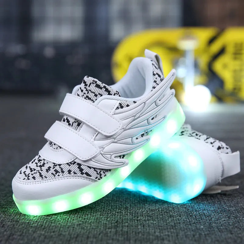 Children's plum red and white LED light up sneakers with USB charging port visible