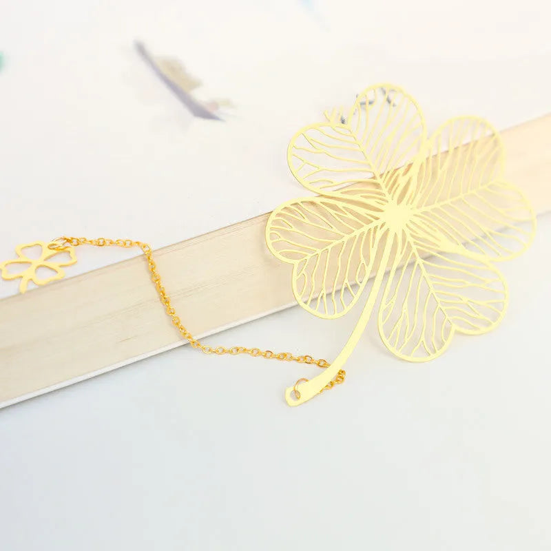 Brass bookmark with hollow-cut leaf design and matching rose gold metal tassel
