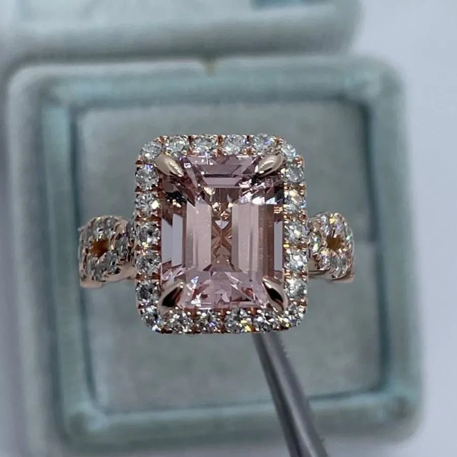 Rose gold electroplated alloy ring with geometric shape on white background