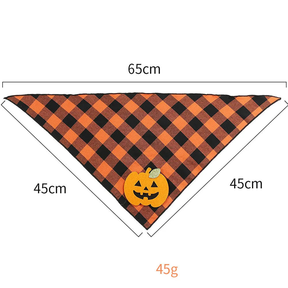 Orange plaid Halloween dog bandana with pumpkin and skeleton felt appliques on a white background