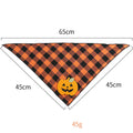 Orange plaid Halloween dog bandana with pumpkin and skeleton felt appliques on a white background