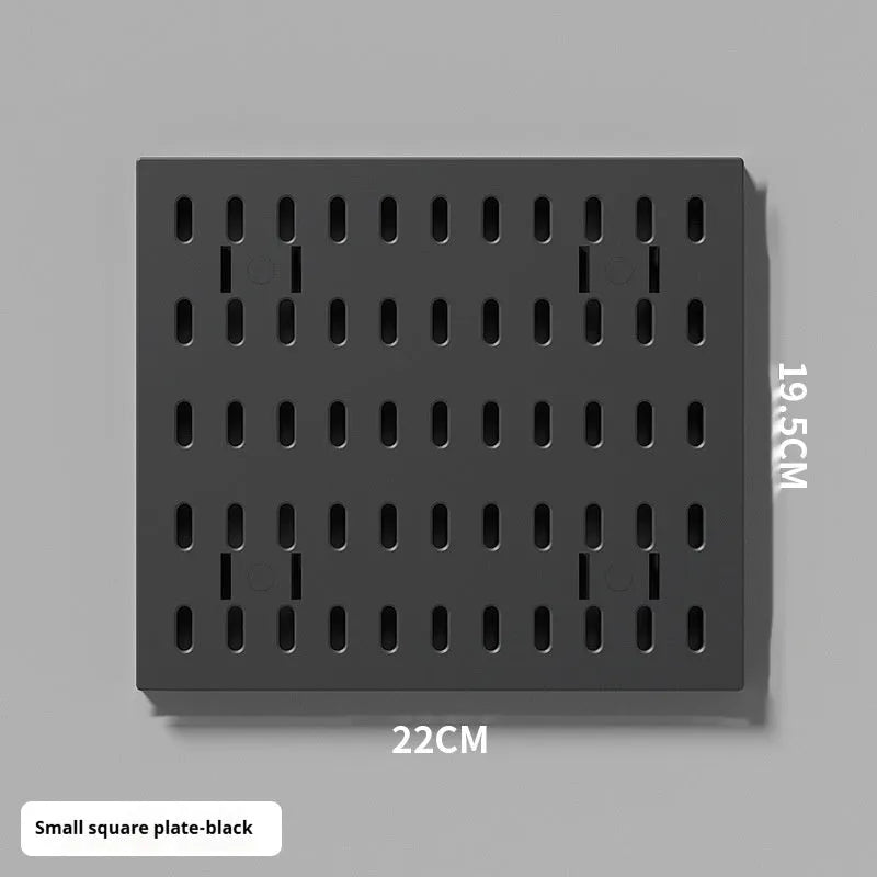 White plastic punch-free wire-wrap board organising cables on wall with modular panel design