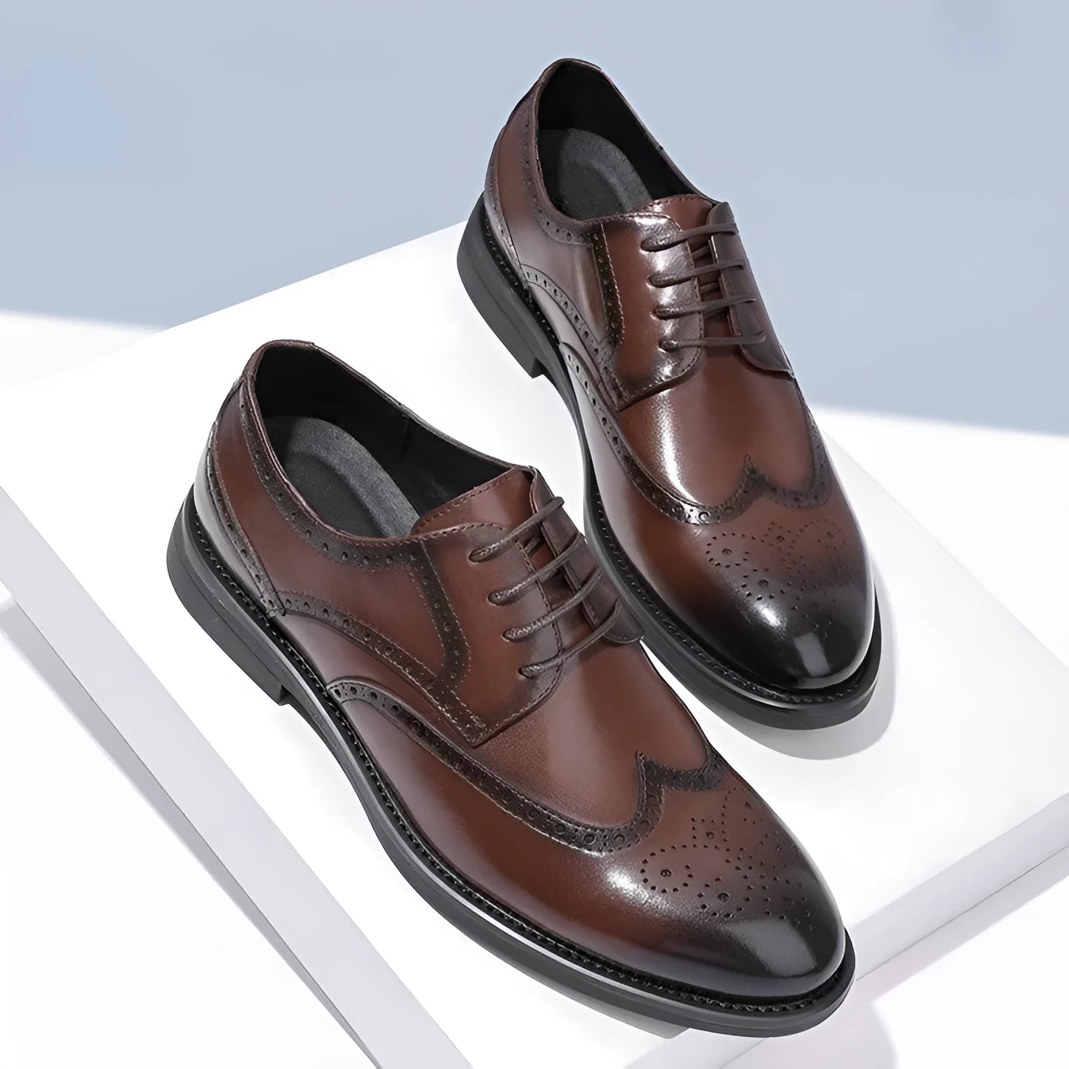 Men's black and brown brogue leather shoes with classic perforated toe design for business wear