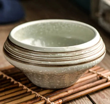 Ceramic Japanese soup bowl with stone conch shape and traditional Edo pattern design