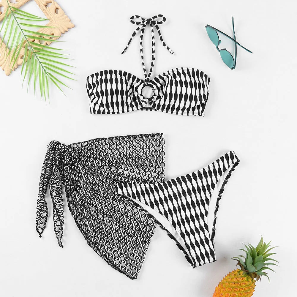 Women's striped three-piece swimsuit set with tube top, shorts, and waist skirt hem