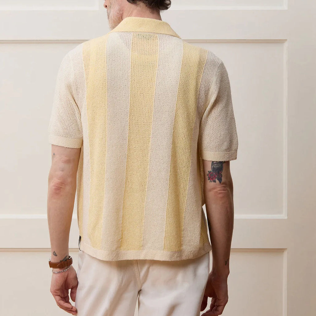 Yellow men's casual polo shirt with hollow-out detailing and an asymmetric short sleeve hem.