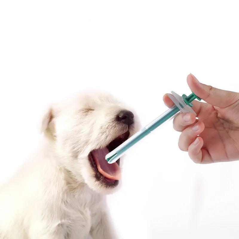 Two silicone pet pill shooter syringes with soft tips, one longer than the other, for administering tablets.