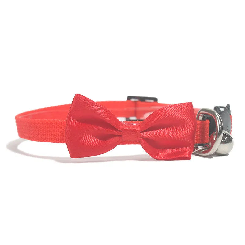 Striped multi-colour adjustable nylon cat collar with a small bell attached.