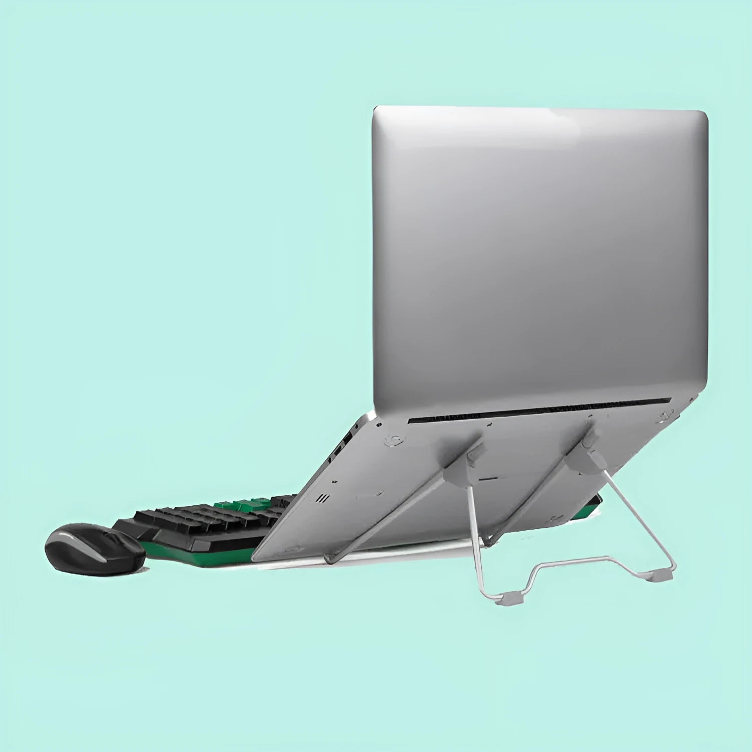 Grey aluminium alloy and plastic mobile phone and laptop stand combo on desk