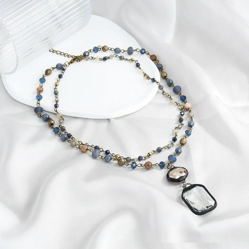 Two-layer tribal style necklace with natural stone and glass pendants on alloy chain