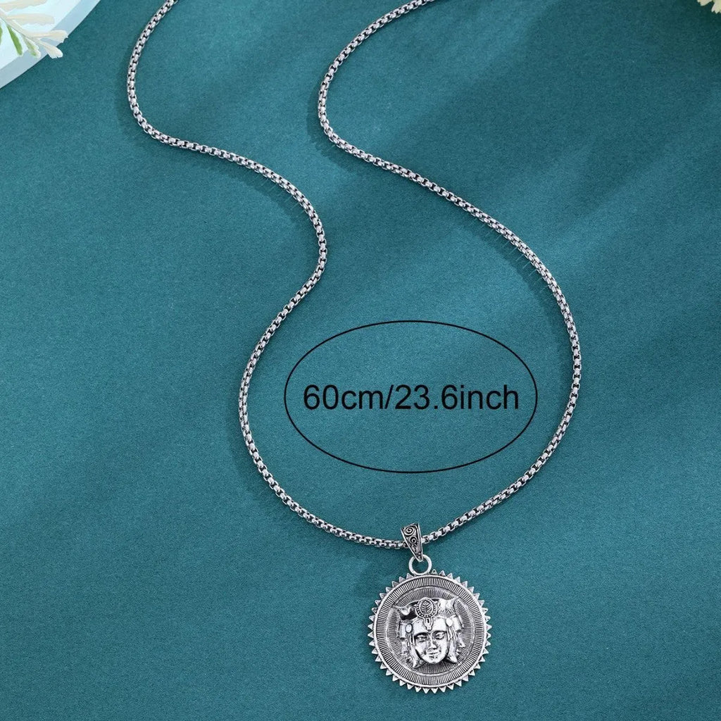 Head pendant sweater chain necklace for men in silver colour with heavy link chain on neutral background