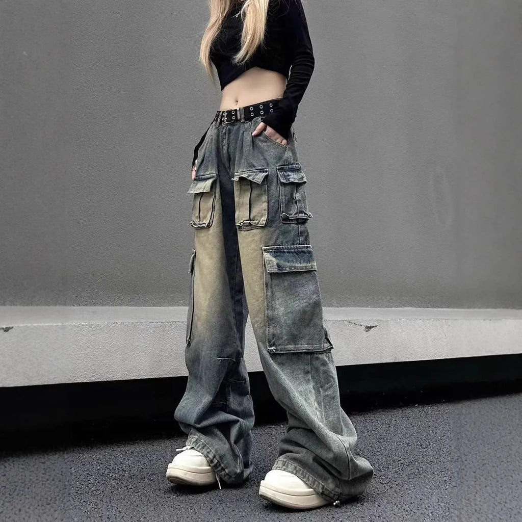 Loose fit distressed denim jeans with multiple pockets in light blue wash