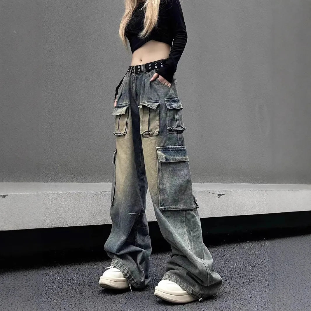 Loose fit distressed denim jeans with multiple pockets in light blue wash