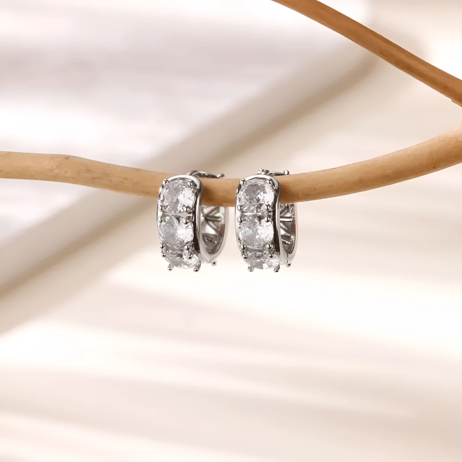 U-shaped stainless steel ear clip earrings for women with inlaid zircon stones in colour E5772P.