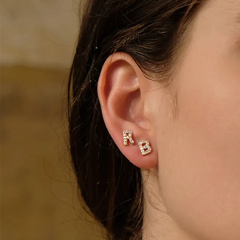 Brass gold plated alphabet letter earrings showing single letter from A-Z range with zircon detailing