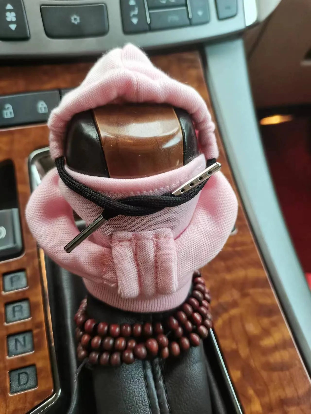 Dutch velvet car gear handle sleeve cover shown in various colours including black, red, blue, and pink.