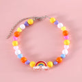 Colourful plastic bead cat necklace in small flower, rainbow, or peach design on adjustable cord.