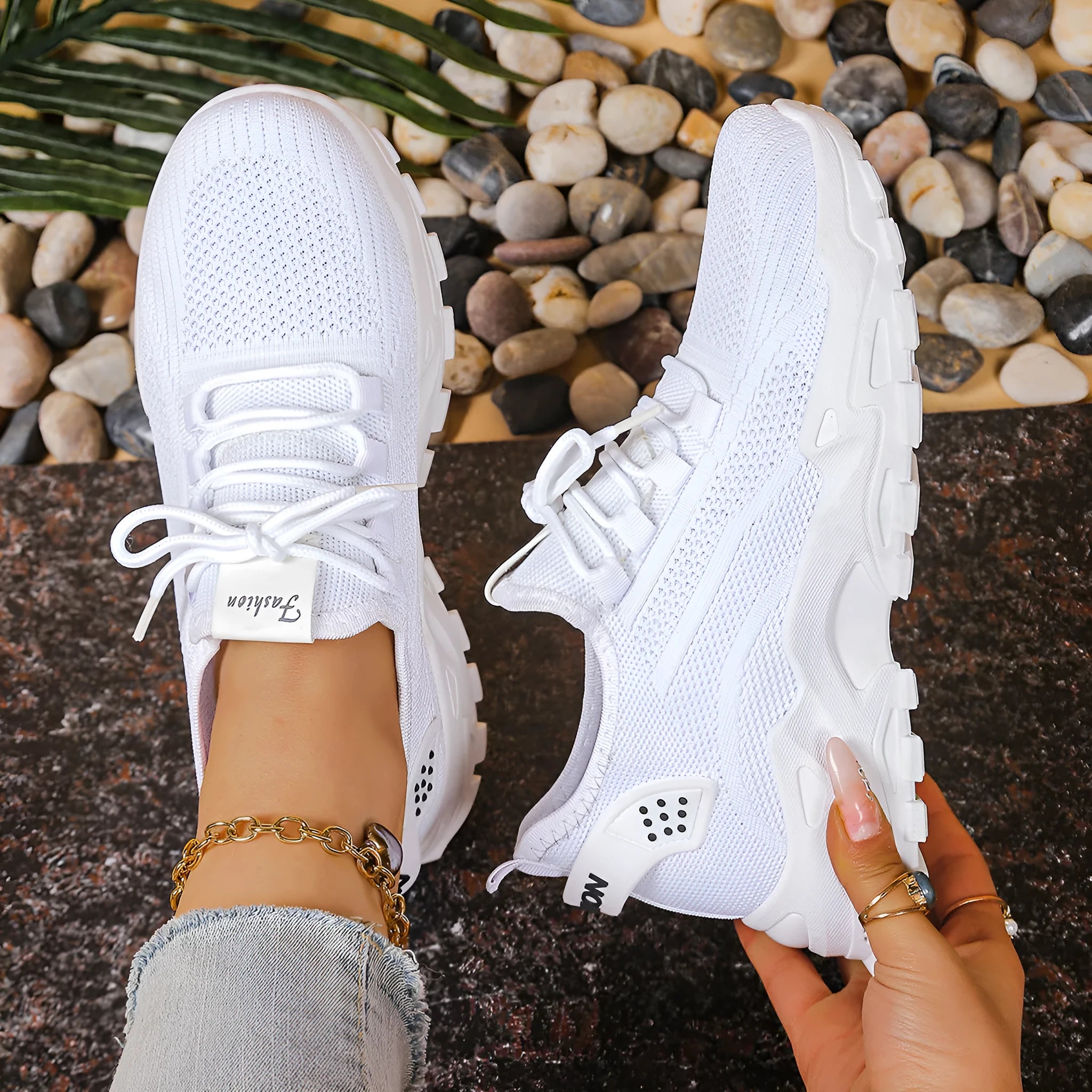 Women's low-top sports shoes with mesh upper and white sole in multiple colours.
