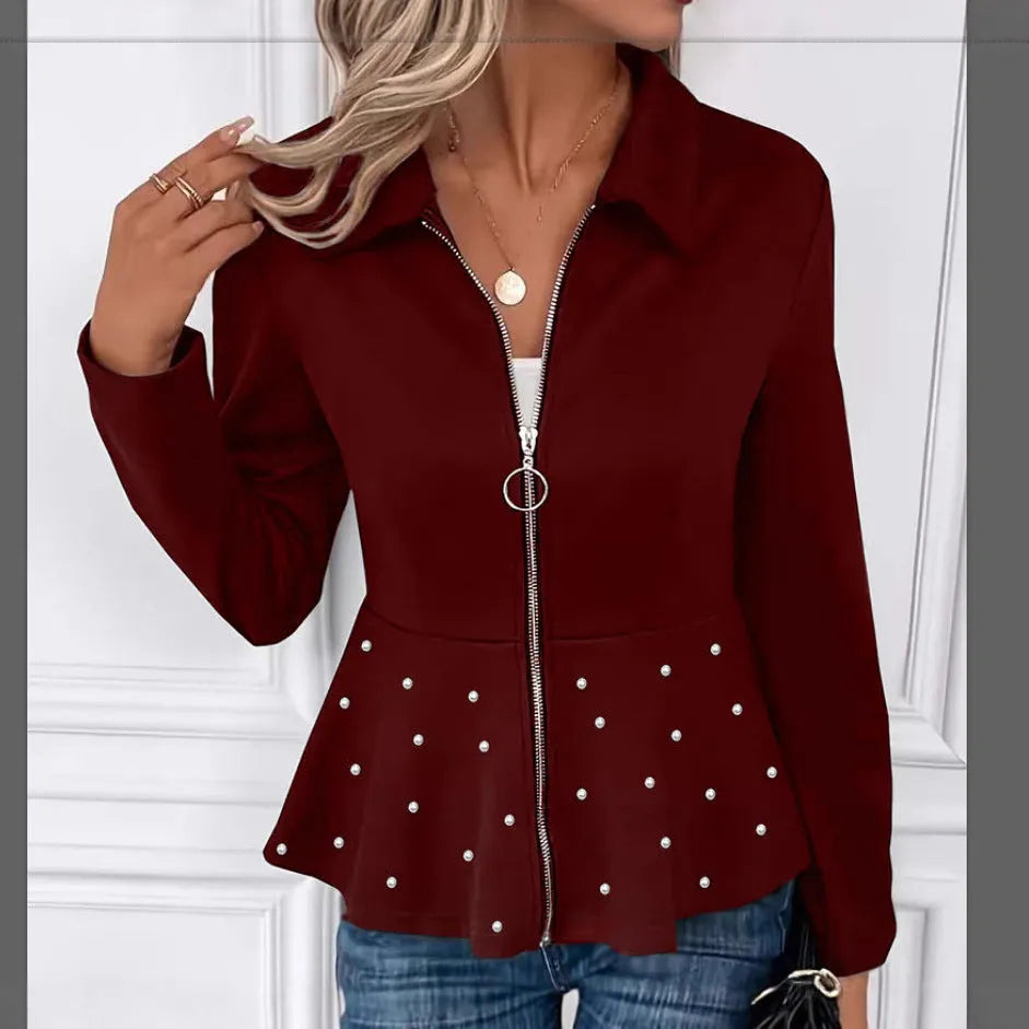 Women's loose fit black coat with a beaded zipper and ruffled hem detail on mannequin.