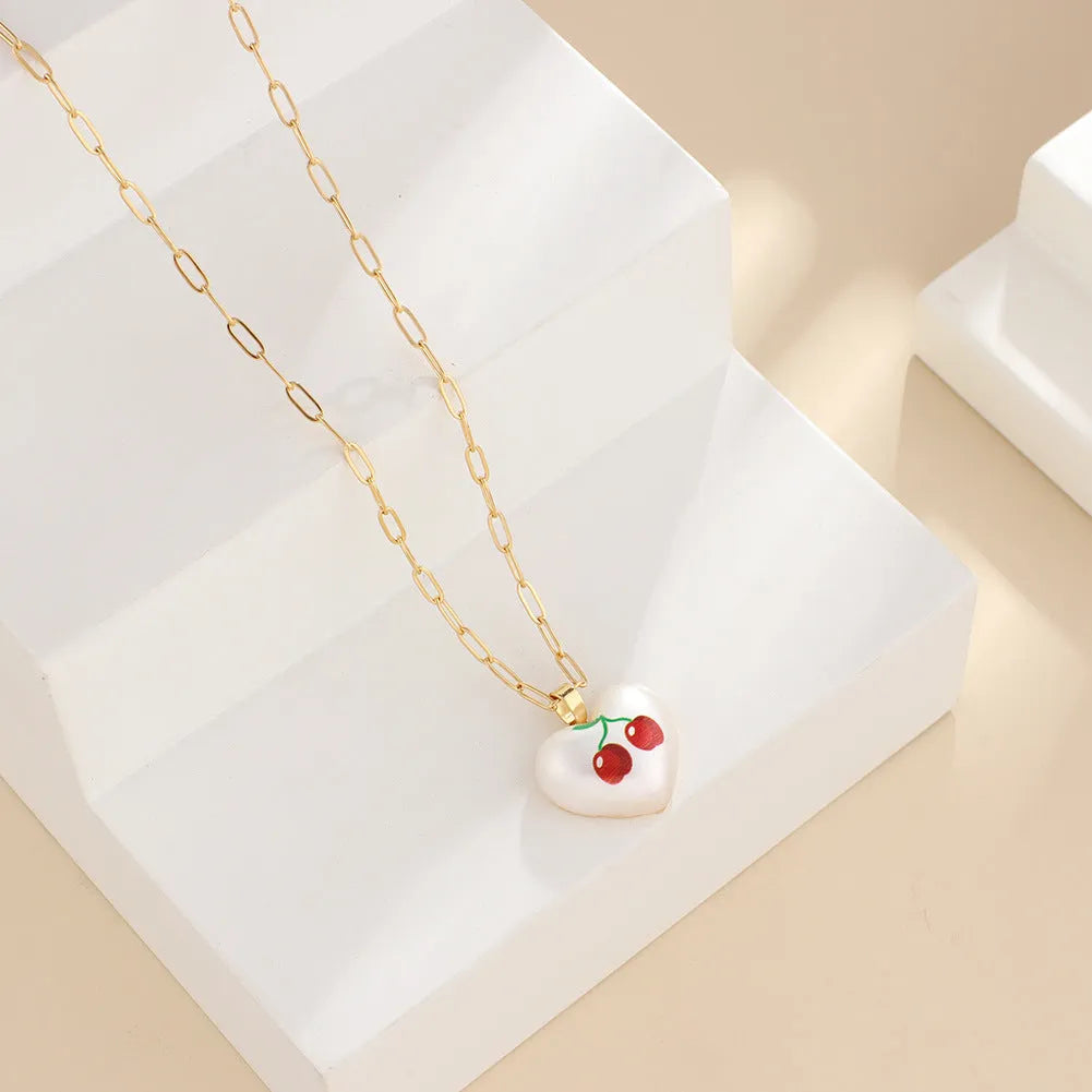 Geometric fruit pendant necklace with adjustable chain showing apple, pineapple, strawberry, cherry and pear designs