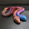 3D printed snake toy decoration in gold colour, 45cm length, PLA material, modern art style