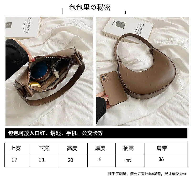Women's retro dumpling-shaped PU leather shoulder bag in black showing sandwich pockets and zippered compartment