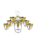 Gold line crystal glass whisky tumbler set with wine bottle and six glasses on a table
