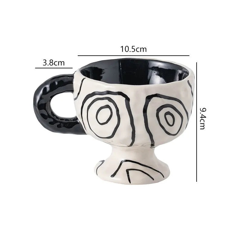 Hand-pinched irregular ceramic mug in solid colour with modern design