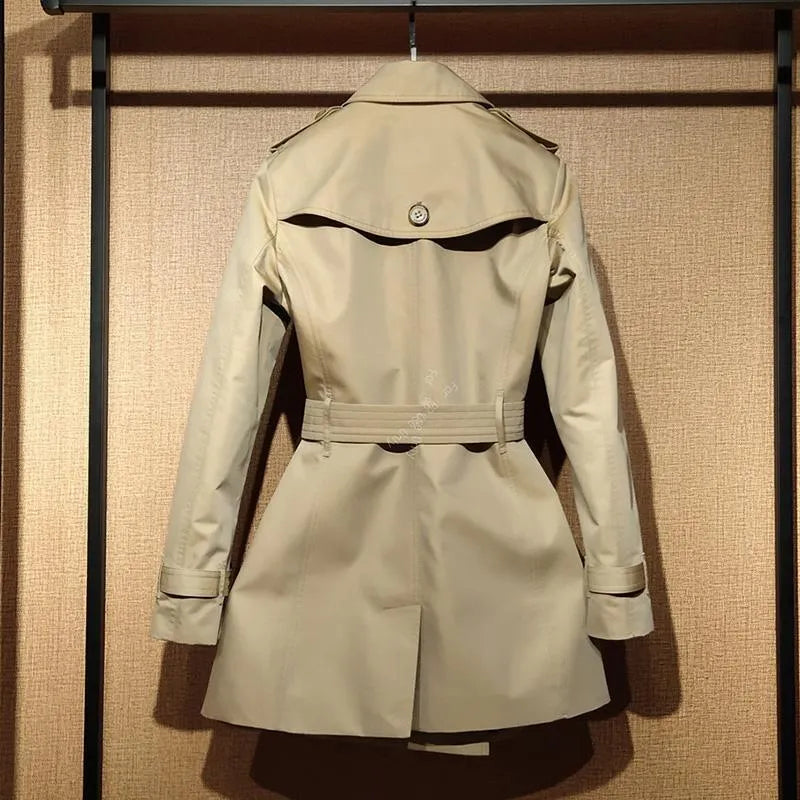 Khaki women's double-breasted trench coat with long sleeves and button fastenings.