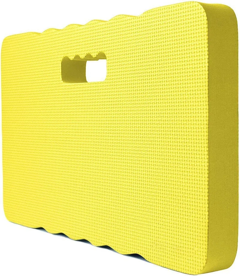 Blue EVA foam garden kneeler pad on grass, showing size next to gardening tools.