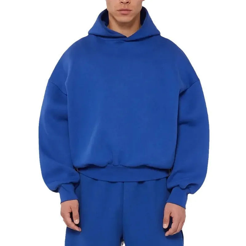 Man wearing a solid colour fleece-lined cotton hoodie sweater with a wool lining.