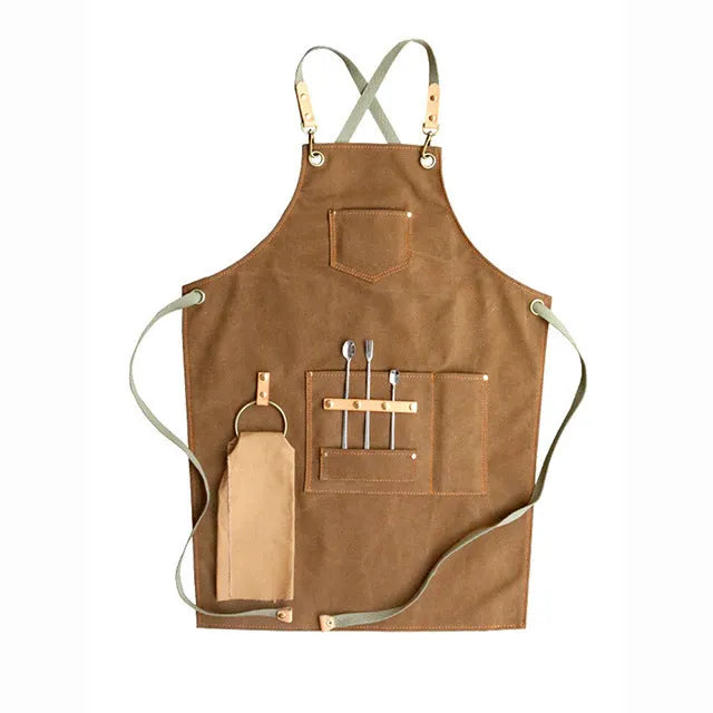 Canvas apron with cross-back straps in camel colour for cafe or baking work