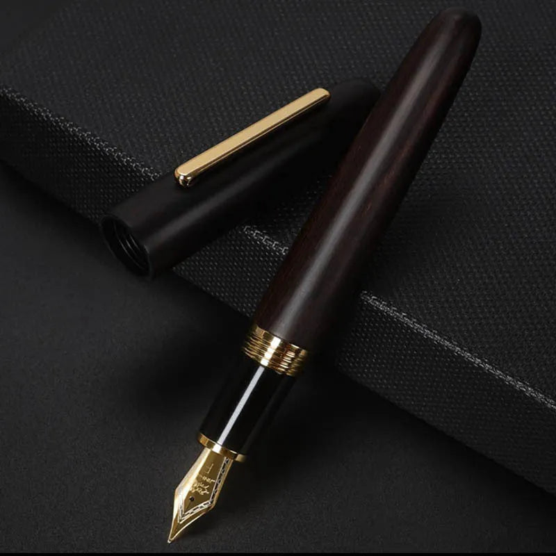 Wooden fountain pen with rotating cap shown in various wood finishes including rosewood and ebony.