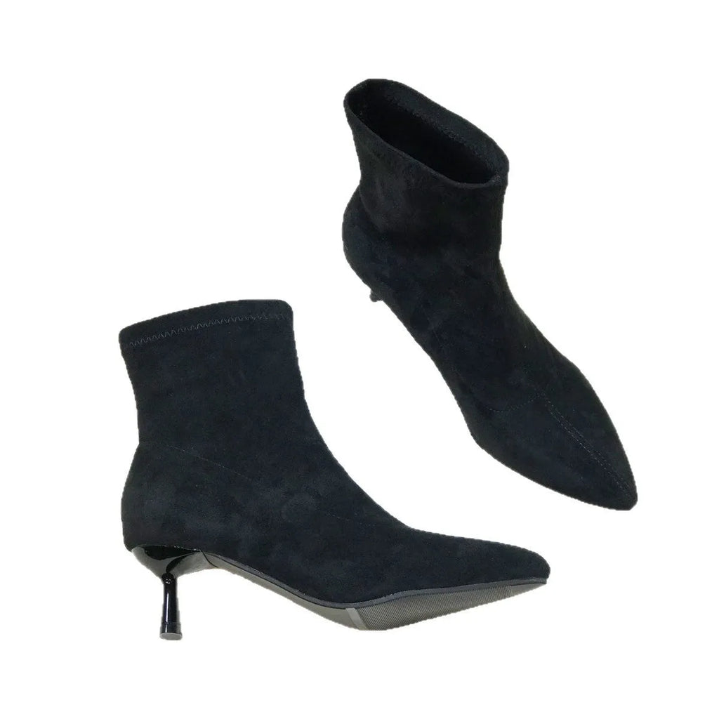 Black pointed toe women's ankle boots with stiletto heel and mid-calf height