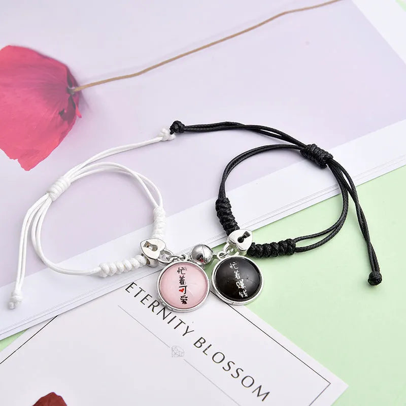 Magnetic clasp couple bracelets with alloy construction and symbolic designs including crown and love lock motifs.