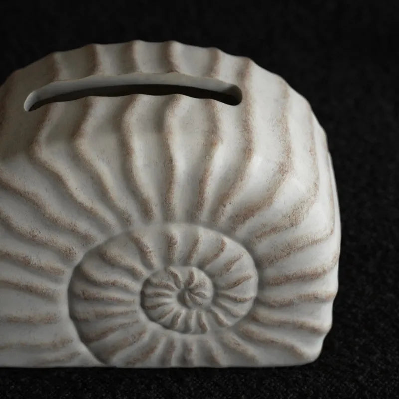 Resin conch shell tissue box decoration in conch ramble colour on wooden table