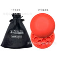 Orange natural rubber golf training mat with centre of gravity zone for swing practice