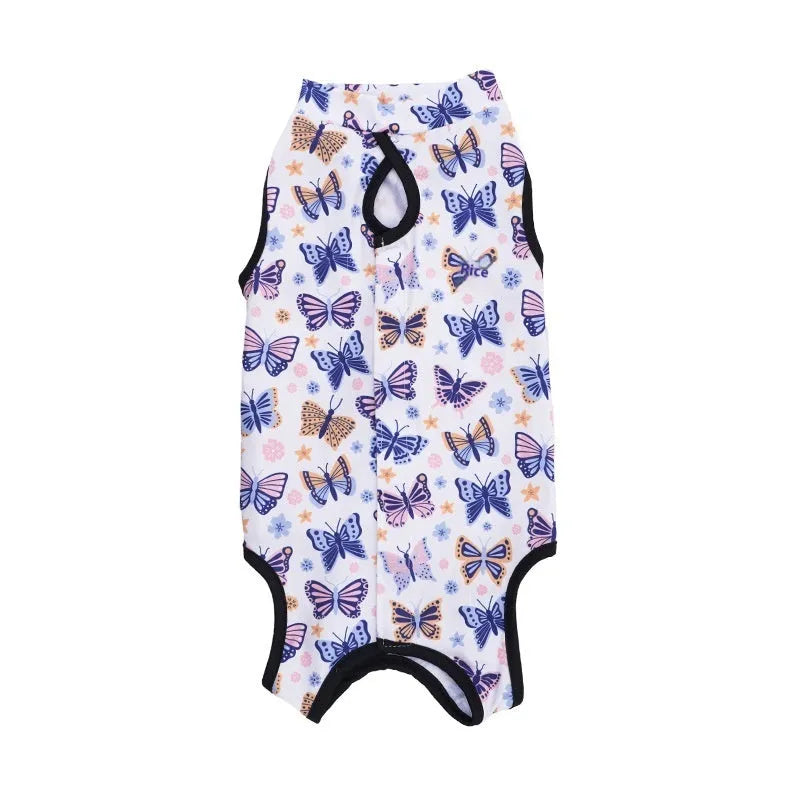 Cat wearing a patterned post-surgery recovery suit with Velcro fastenings on the back.