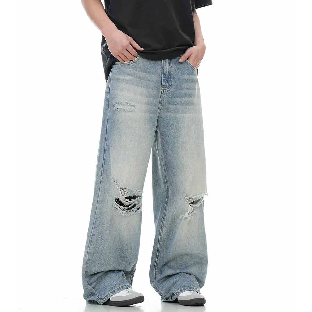 Blue men's straight-leg ripped jeans with a cotton blend fabric and zipper fly.