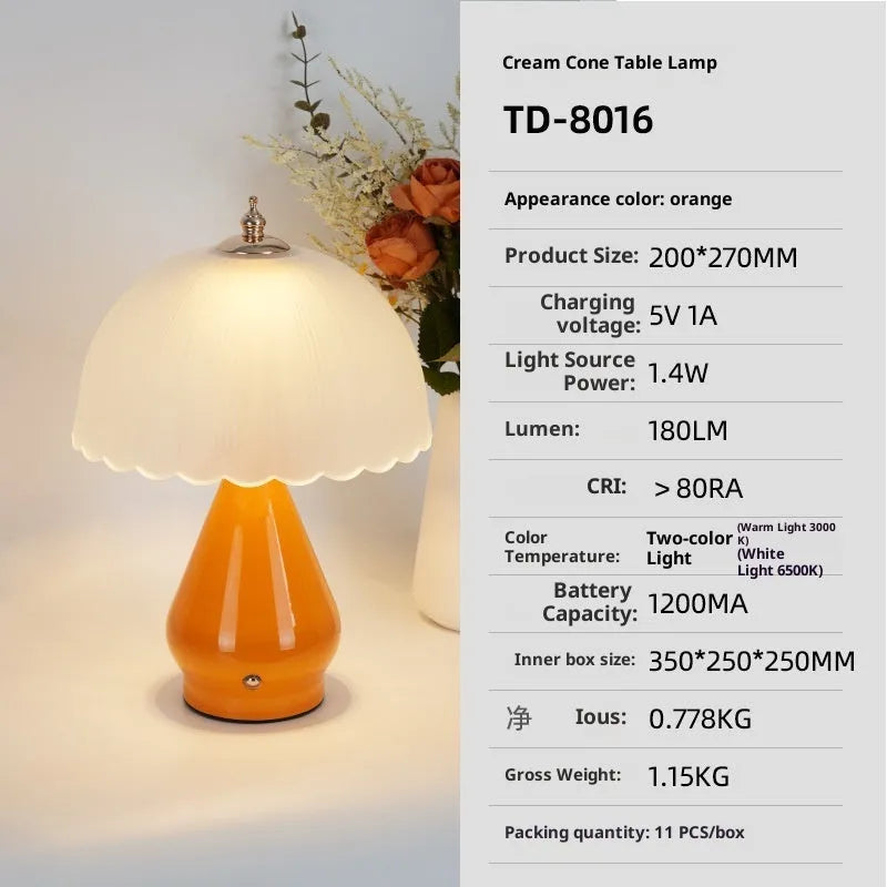 Geometric 3D table lamp in black with warm light on a wooden side table in a modern living room