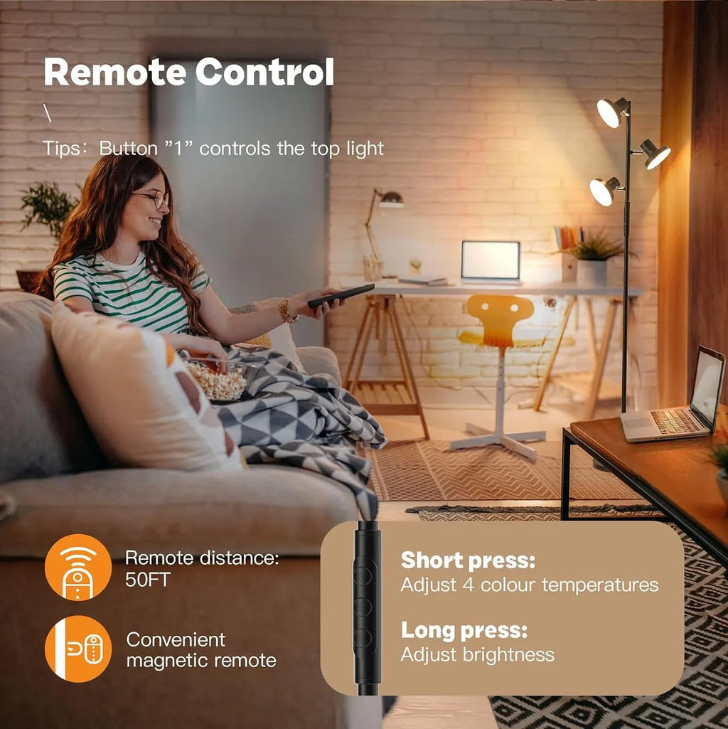 Black adjustable floor lamp with rotatable head and remote control in a living room