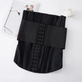 Apricot and black nylon waist training belt with adjustable tie on a white background