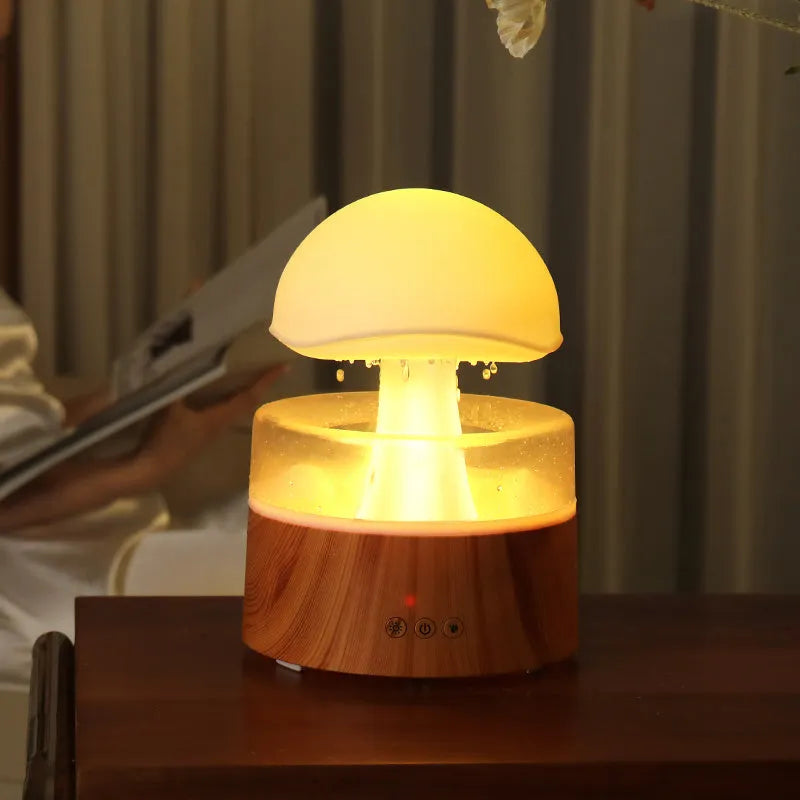 White cloud-shaped ultrasonic humidifier and aroma diffuser with colourful lighting and simulated raindrops