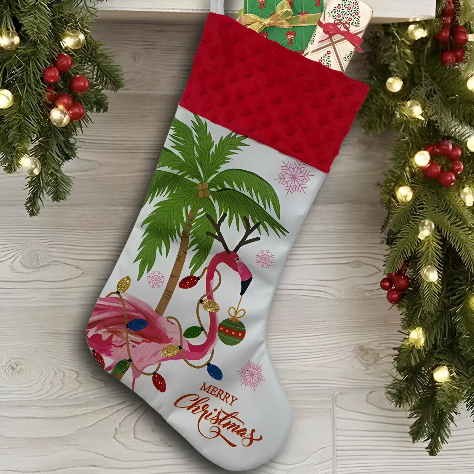 Red cloth flamingo Christmas stocking decoration with white trim, shown hanging.