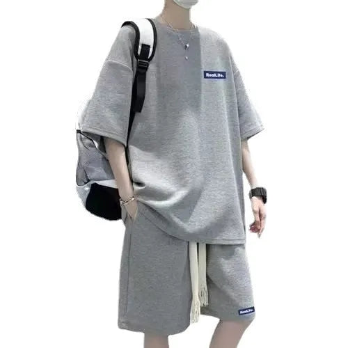 Waffle textured men's leisure sports suit with short sleeves and matching shorts in cotton-polyester blend